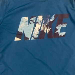 Nike boys size xl dry fit teal top. Good condition Nike Logo pre owned